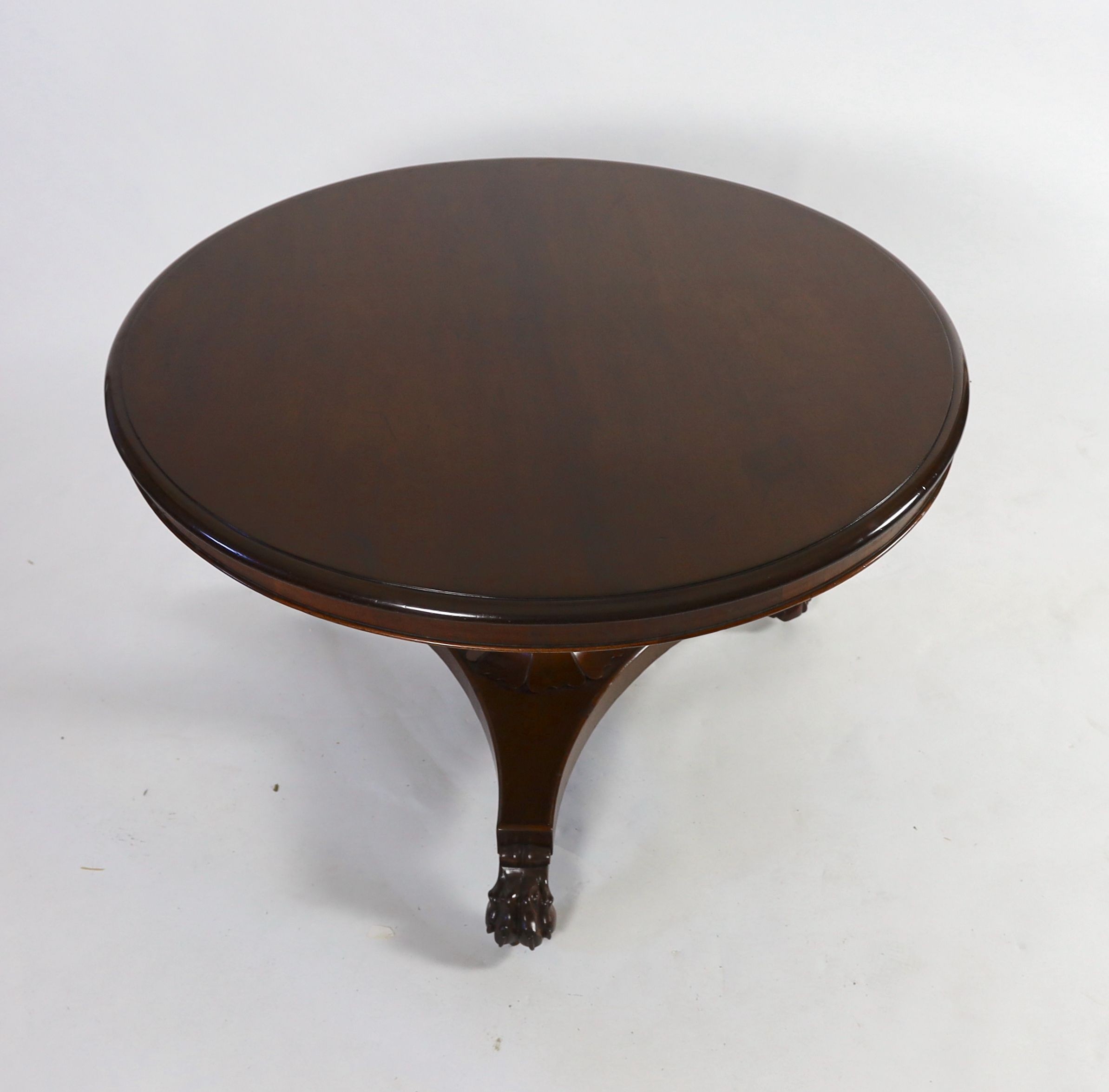 A William IV circular mahogany tilt top breakfast table, on octagonal tapered pillar, diameter 116cm height 73cm
